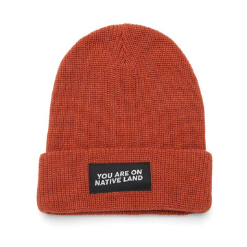 'YOU ARE ON NATIVE LAND' RIBBED BEANIE - REDWOOD